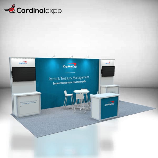 10' x 20' exhibit rental structure with 1-meter storage counter in front, and two 1-meter storage counters on opposite ends of the back wall. Above both back counters are display monitors. Rendering features high table and 4 chairs.