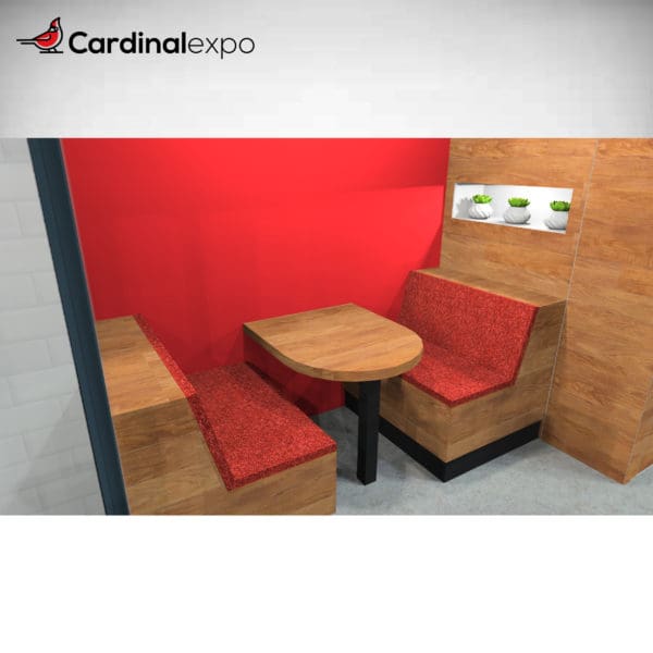 Meeting space of the 10' x 20' booth structure #007. Features brandable wall, booth-style seating, and inset shelf space for decor or accessories.