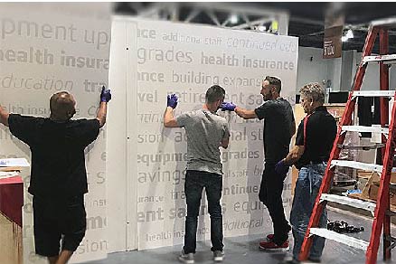 Images for Services Page CE Website-03 Site supervisor with team on trade show floor
