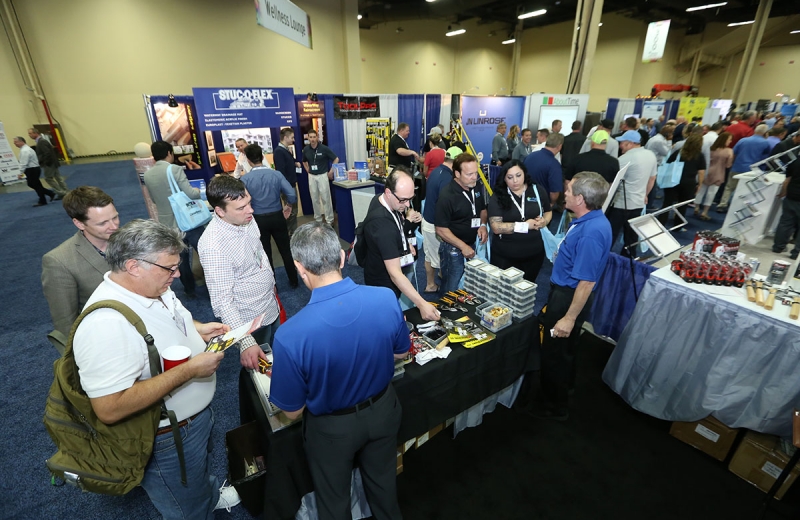 Attendees at the 2017 Intex Construction Expo browse through materials and handouts on display.