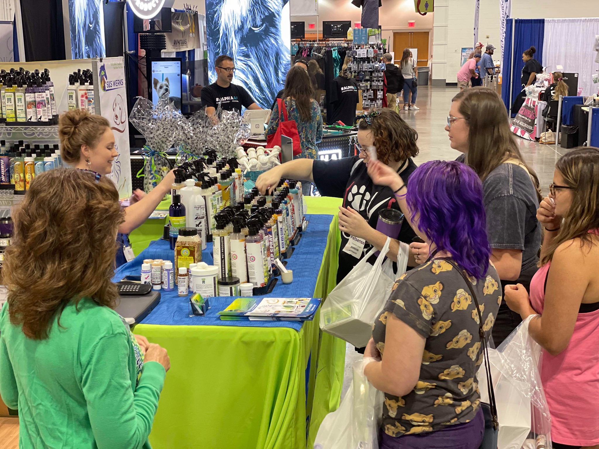 An exhibitor shows products to onlookers at the 2021 Atlanta Pet Fair & Conference.