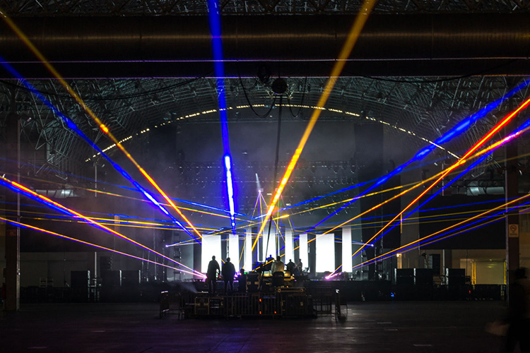 Colorful laser lights stream up from the event stage of Festival Hall at Navy Pier in Chicago.