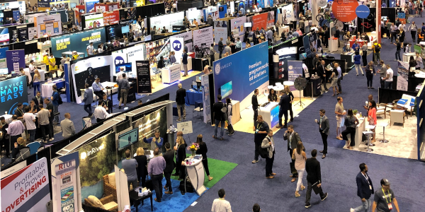 Attendees and exhibitors mingle on the show floor at retailX 2019 in Chicago.