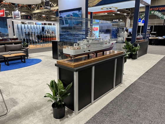 A model boat in a display case to draw attention at our customer's International WorkBoat Show booth