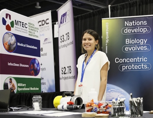 Attendees at the 2022 Experience Power conference mingle among exhibition booths.