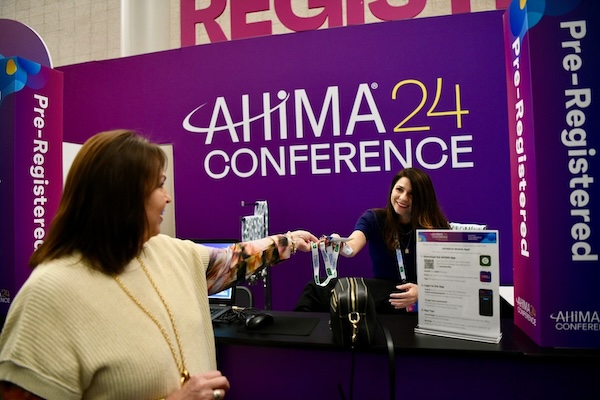 Conference attendees enter the Geo Week exhibition hall.