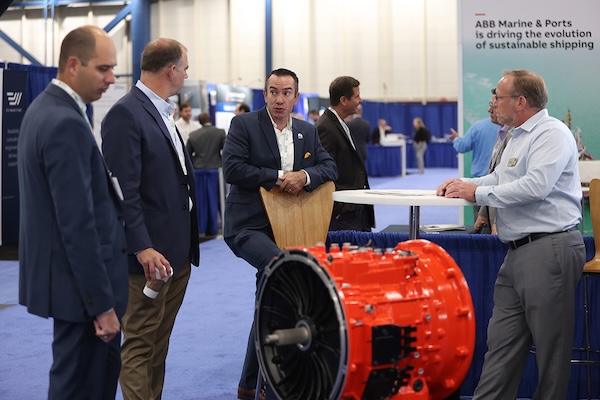 Conference attendees enter the Geo Week exhibition hall.