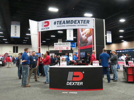 Attendees at the 2022 Middle Tennessee Realtors Convention, seated behind a table and smiling at the camera.