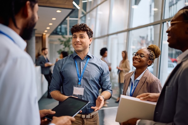 Visitors looking at the booths at NHS. It's important to carefully plan your National Hardware Show Booth cost to ensure you can attract audiences without breaking the bank.