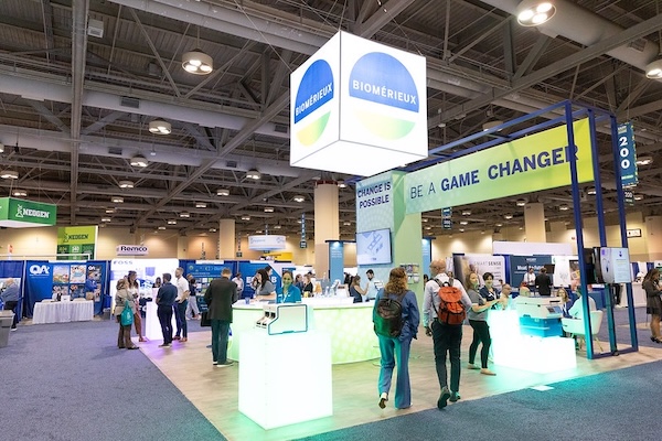 Conference attendees enter the Geo Week exhibition hall.