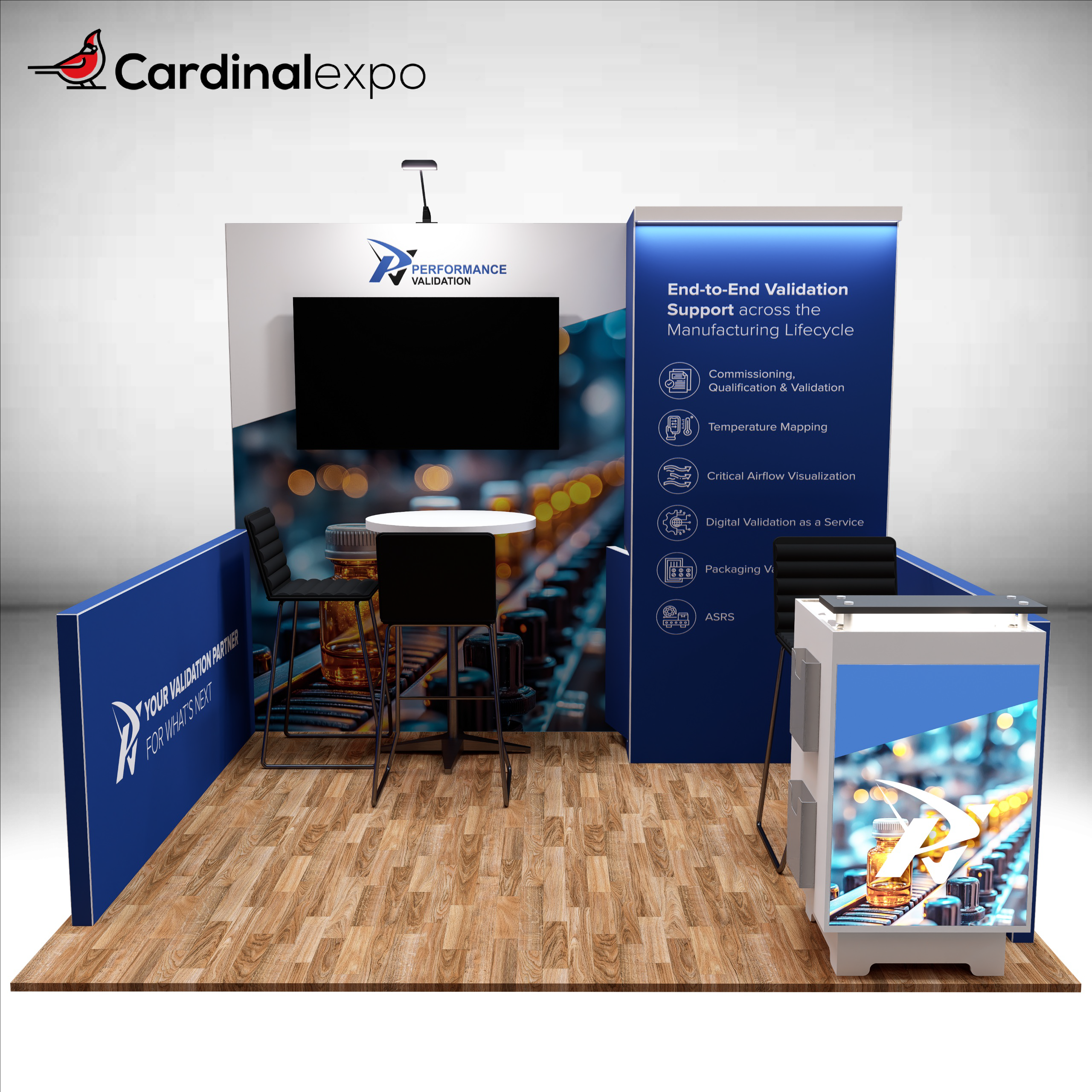 Front perspective of an exhibition booth structure with a backlit reception counter, TV monitor, side wall, and bistro table.