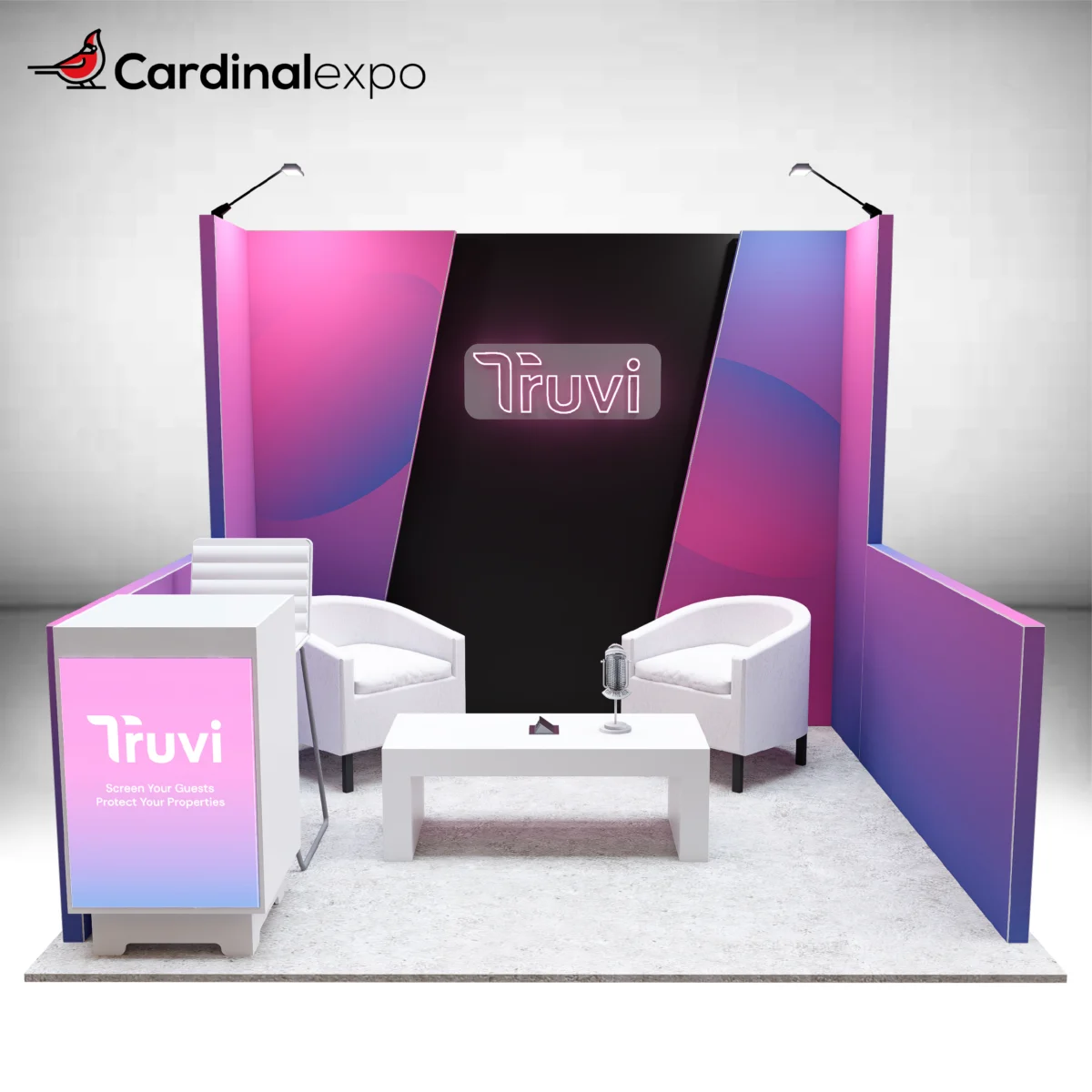 Front view of a 10x10 trade show display with a backlit reception desk, coffee table, and lounge chairs.