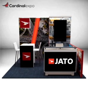 Frontal view of a 10x10 exhibition booth featuring a reception counter, vertical monitor, tower, and meeting table.