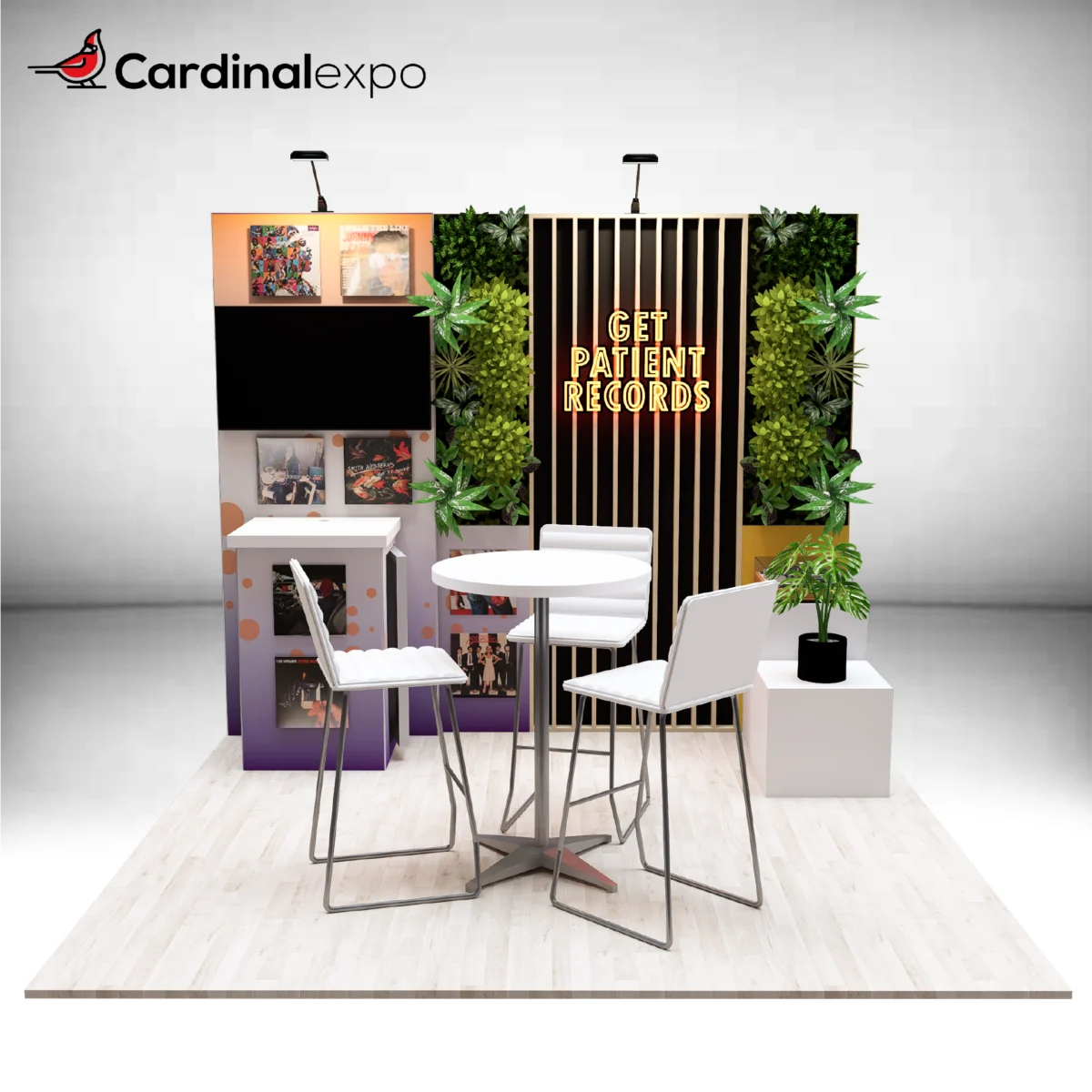 Front view of a 10x10 booth showcasing a slatted backwall, vertical plant walls, TV, podium, and bistro seating.