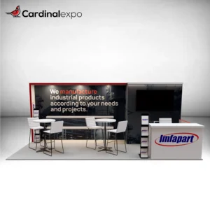 Front perspective of a 10x20 trade show display featuring an industrial graphic backdrop, floating shelves, dual high-top bistro seating, a branded reception desk, and a side storage room with a mounted TV monitor.