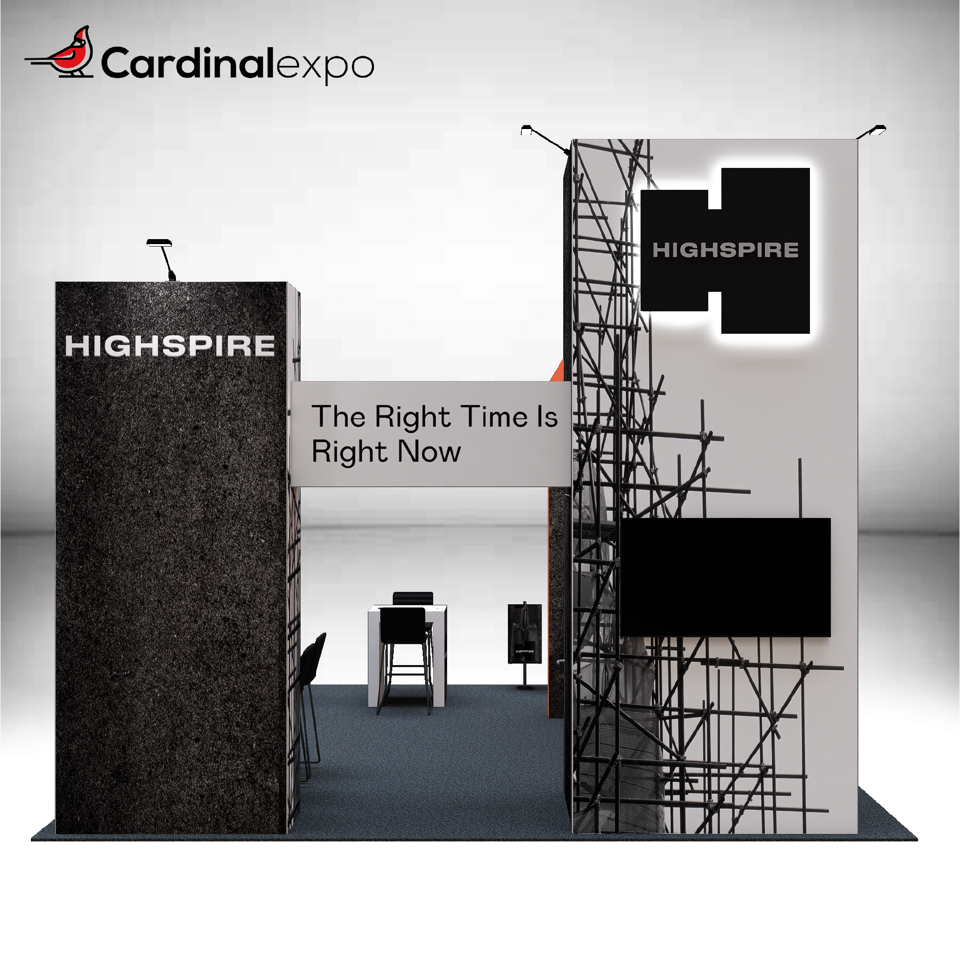 Rear view of a 20x20 island booth showing a tall illuminated tower, connecting bridge sign, and TV monitor.