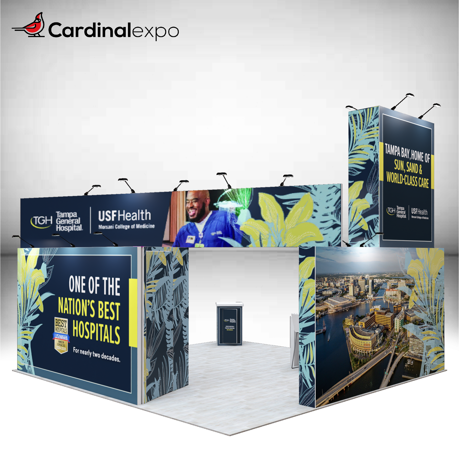 Back-left angle of a 20x20 trade show exhibit rental featuring full-coverage hospital branding walls, aerial city graphics, and a tall tower structure.