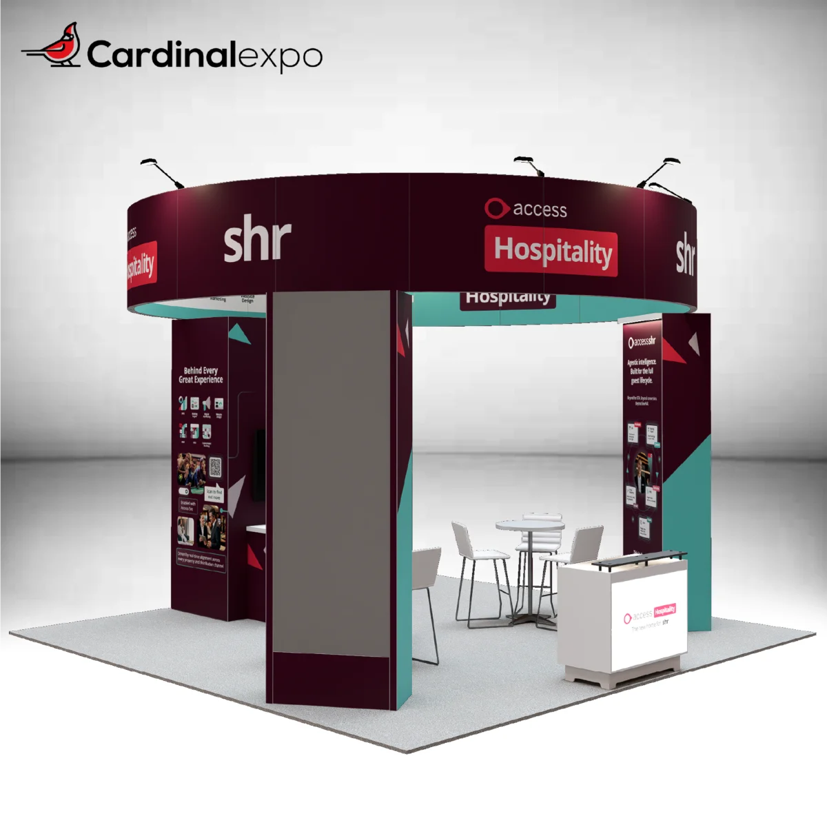 Front-left view of a 20x20 island exhibit highlighting a round header beam, graphic pillars, backlit desk, and meeting area.