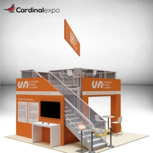 Front-left angle of a double-deck 20x20 trade show display rental showcasing a side staircase, upper deck seating, hanging banner sign, and reception workstation.