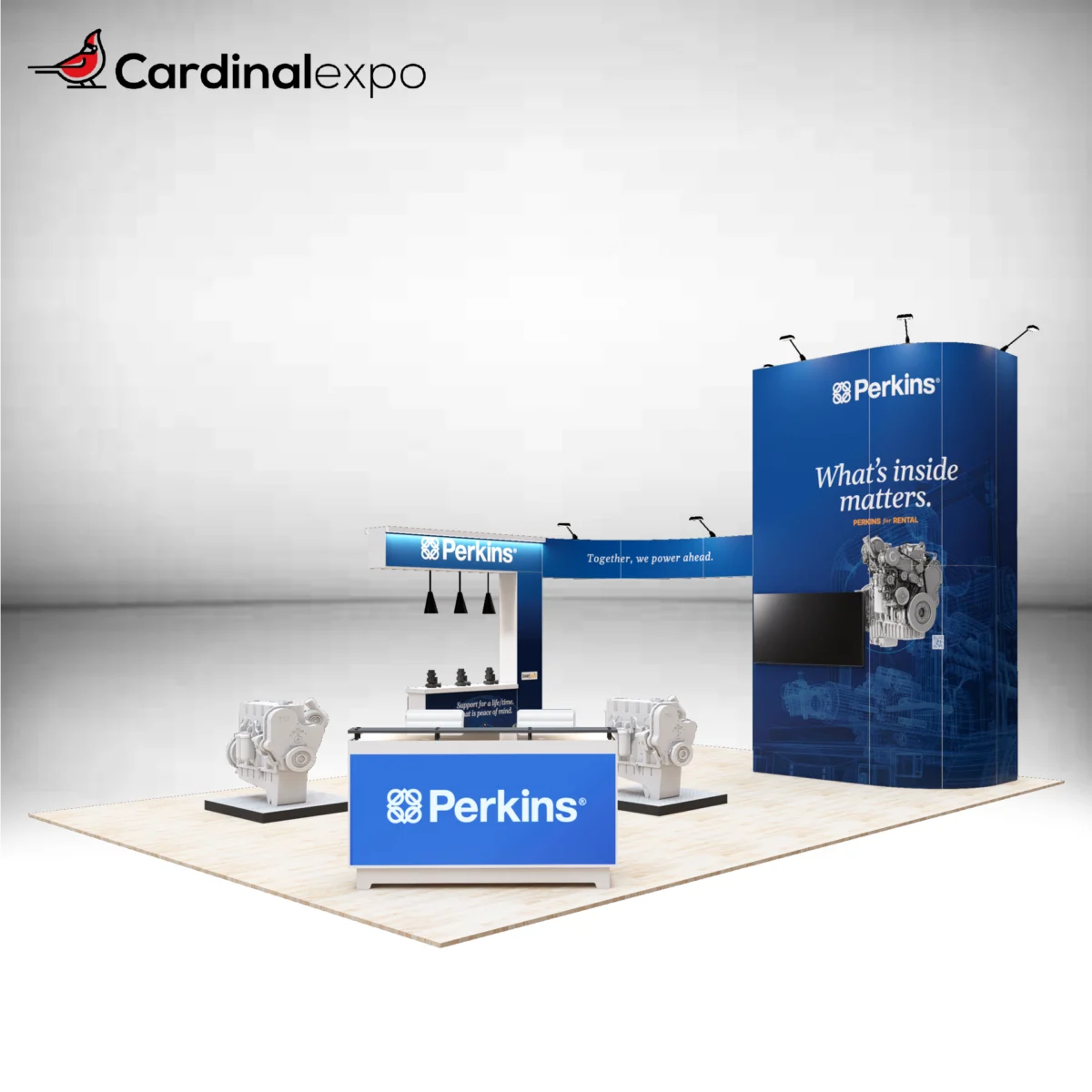 Front-right perspective of a large custom trade show display rental showcasing a branded reception desk, engine equipment pedestals, TV display wall, and overhead arch header.