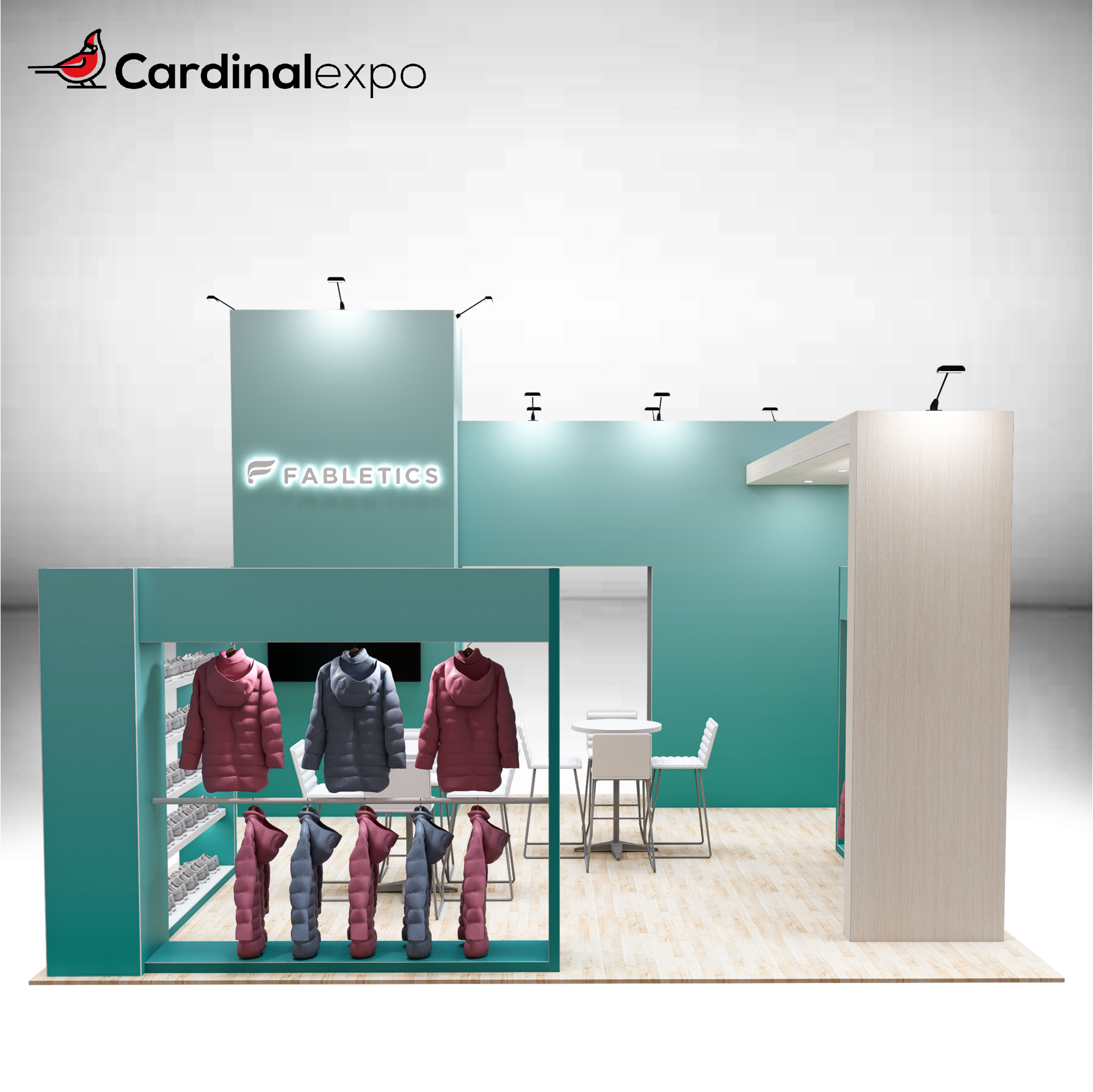 Front view of a 20x20 trade show booth rental featuring a teal branding tower with a 3D backlit logo sign, front clothing display rack, wood accent arch, and bistro seating sets.