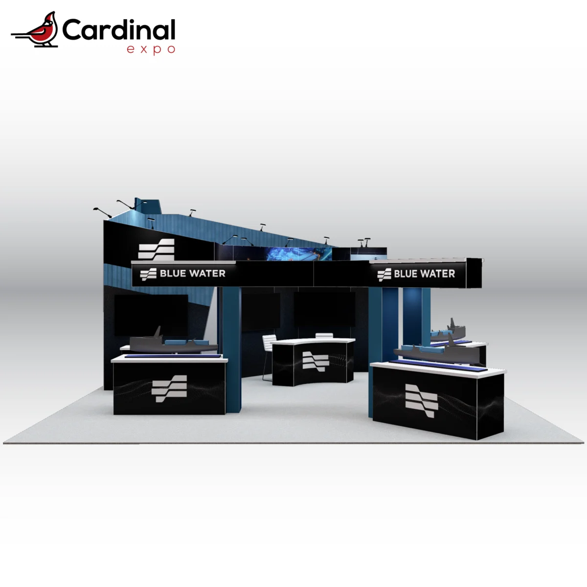 Front view of a large custom trade show booth rental featuring overhead branding headers, model ship display counters, TV monitors, and dark blue graphic backwalls.